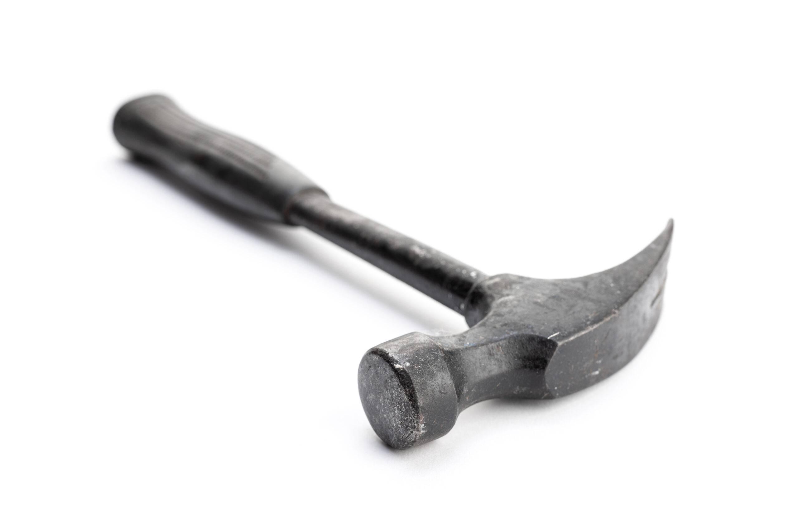 Aged claw hammer isolated on white background.