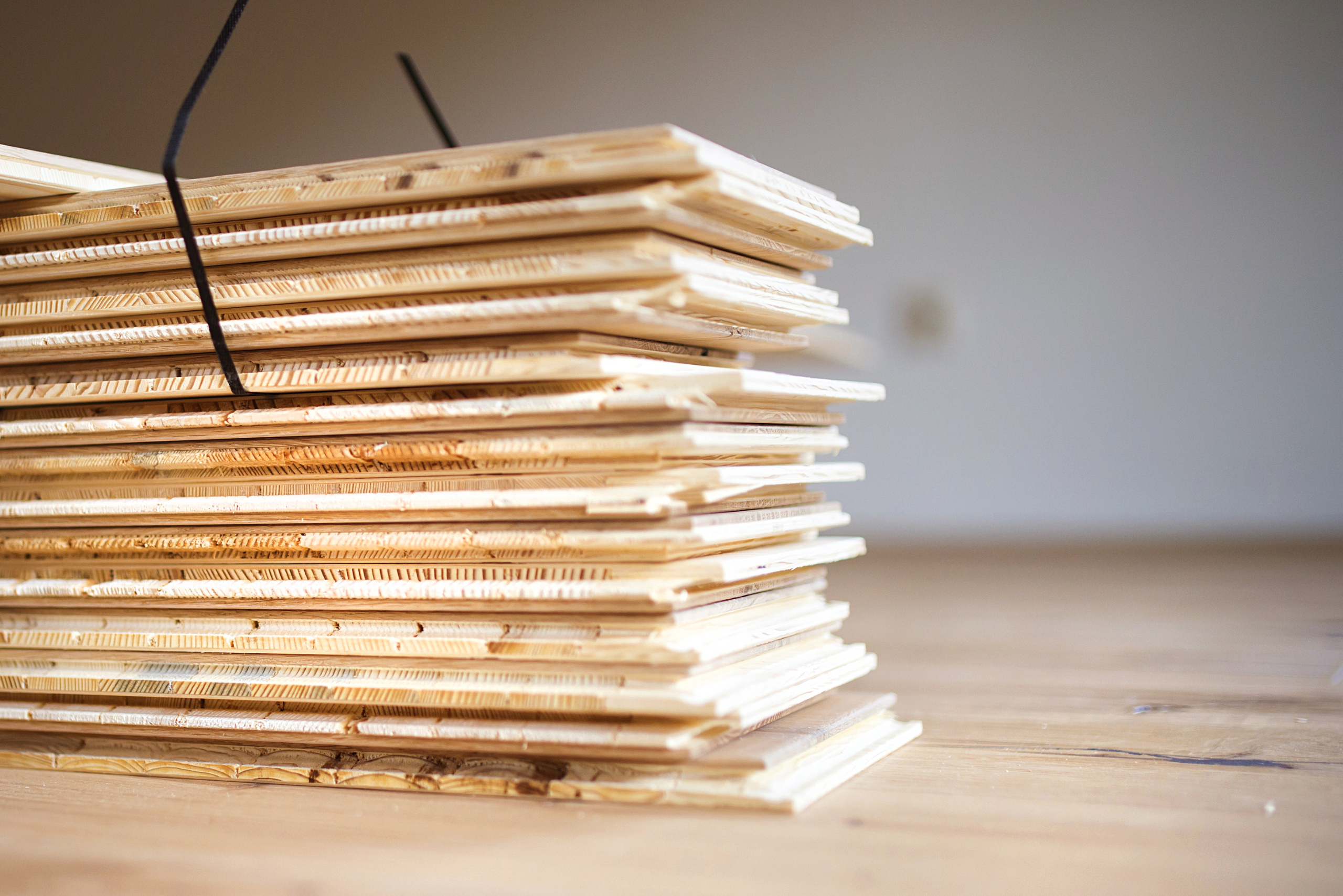 Stack of subfloor plywood boards.