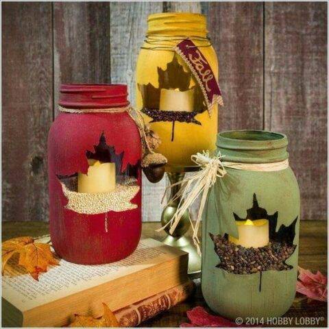 Mason jars painted with leaf window fall colors.