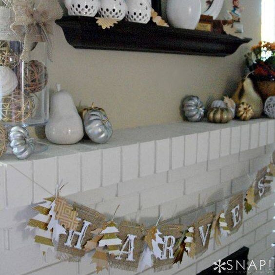 Harvest banner fall decorated mantle.