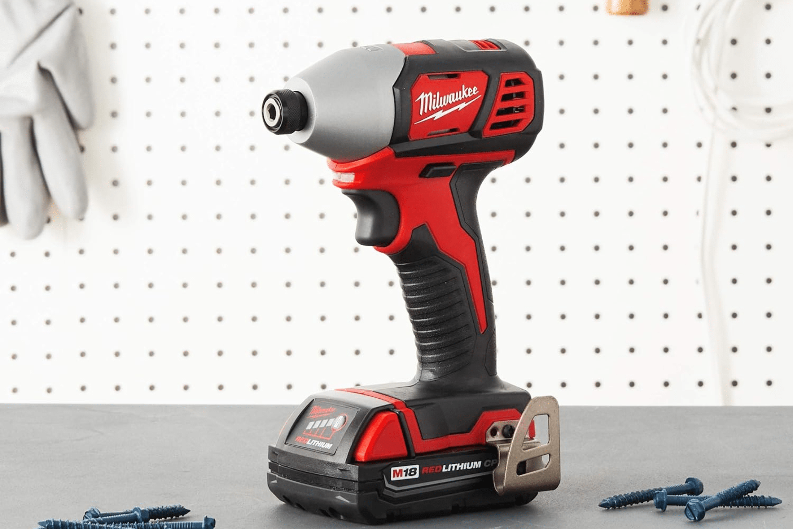 Impact driver placed on work bench.