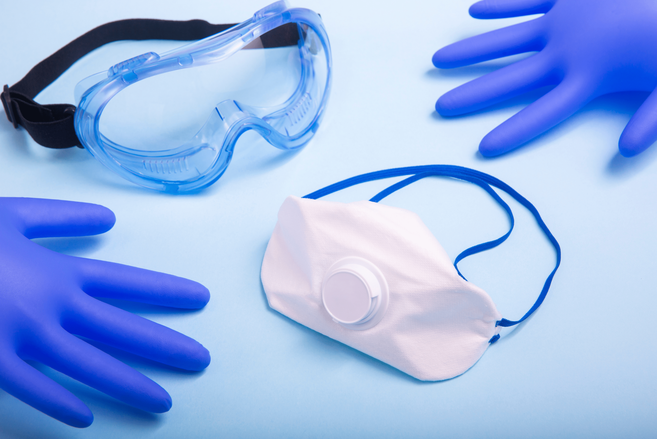 Protective equipment on a blue background.