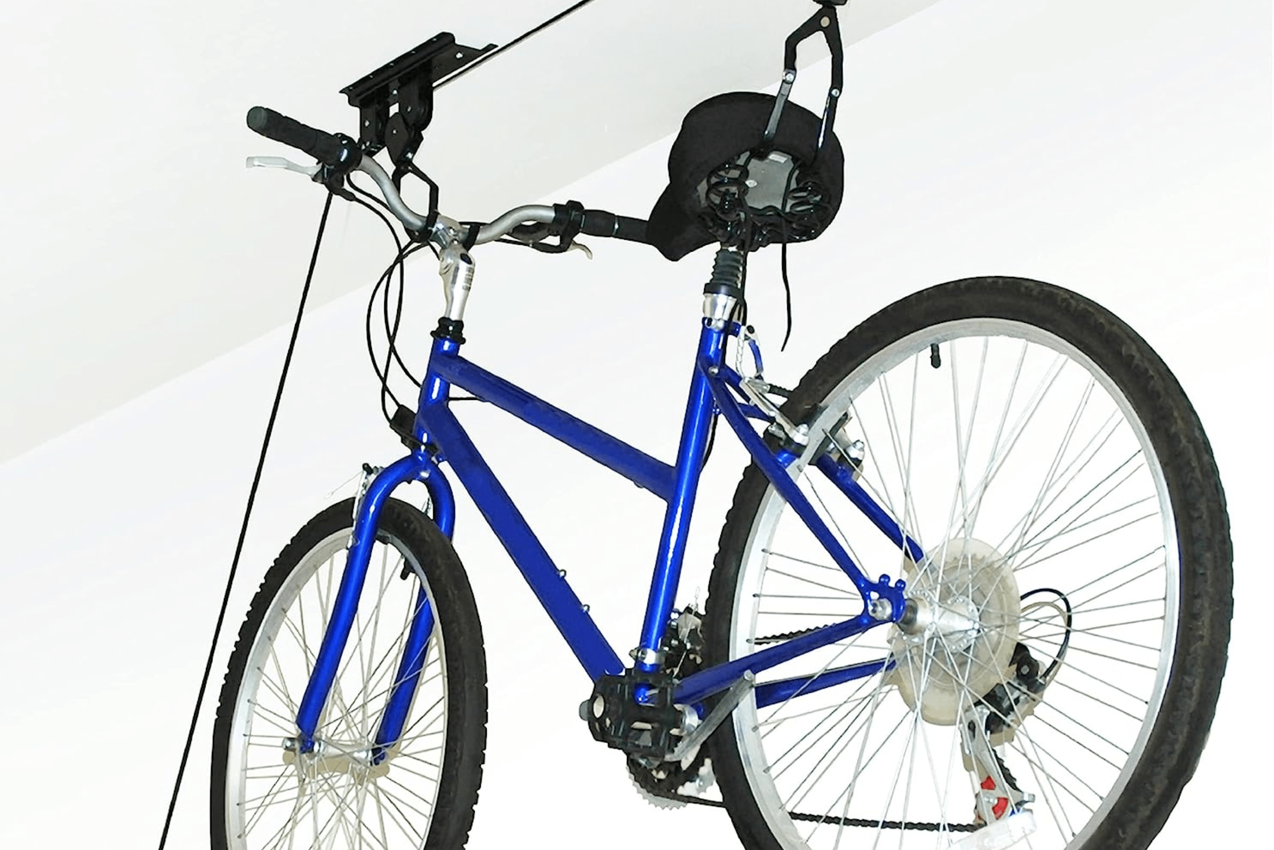 Bike mounted on a ceiling garage bike rack.
