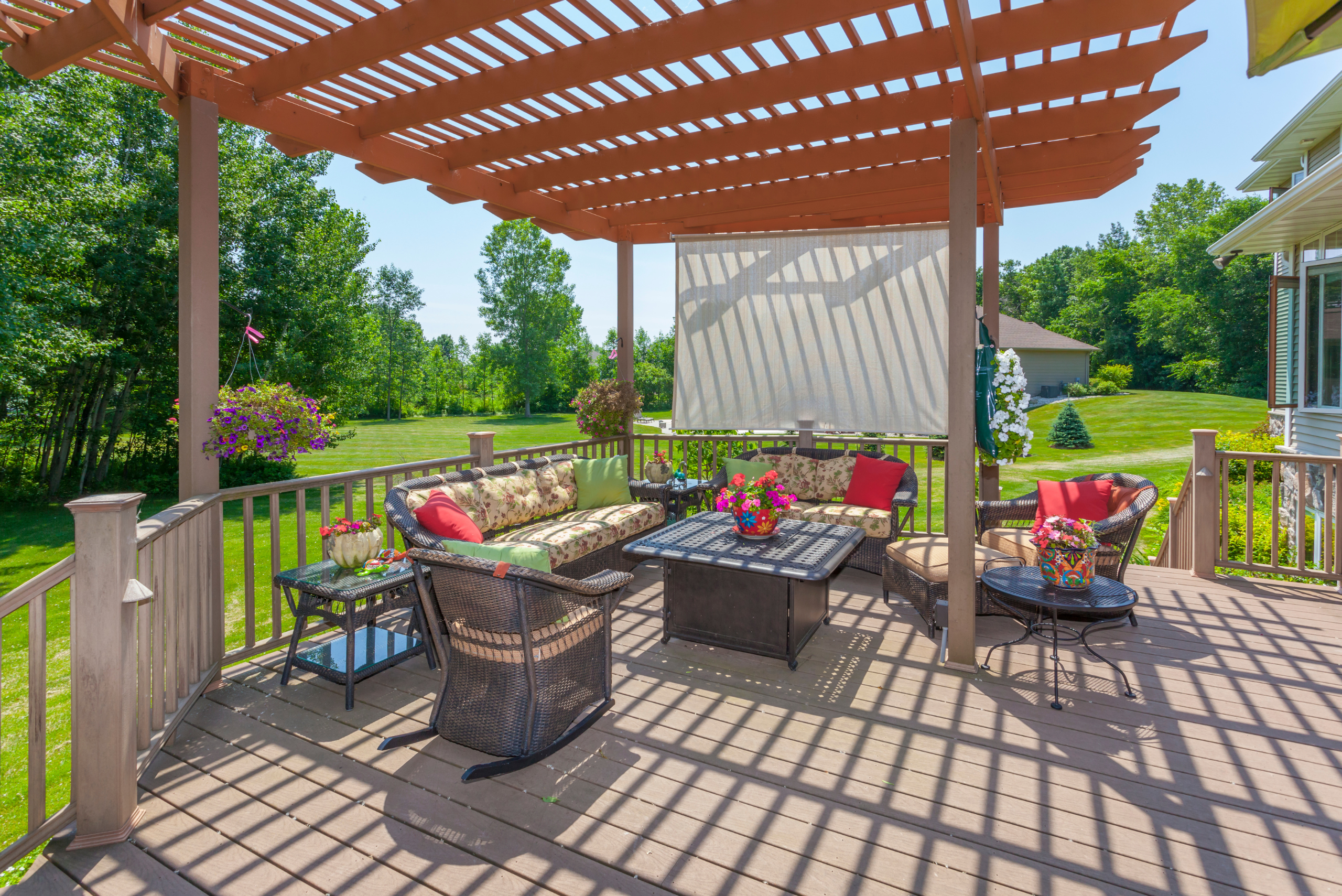 Backyard patio with a wooden awning.