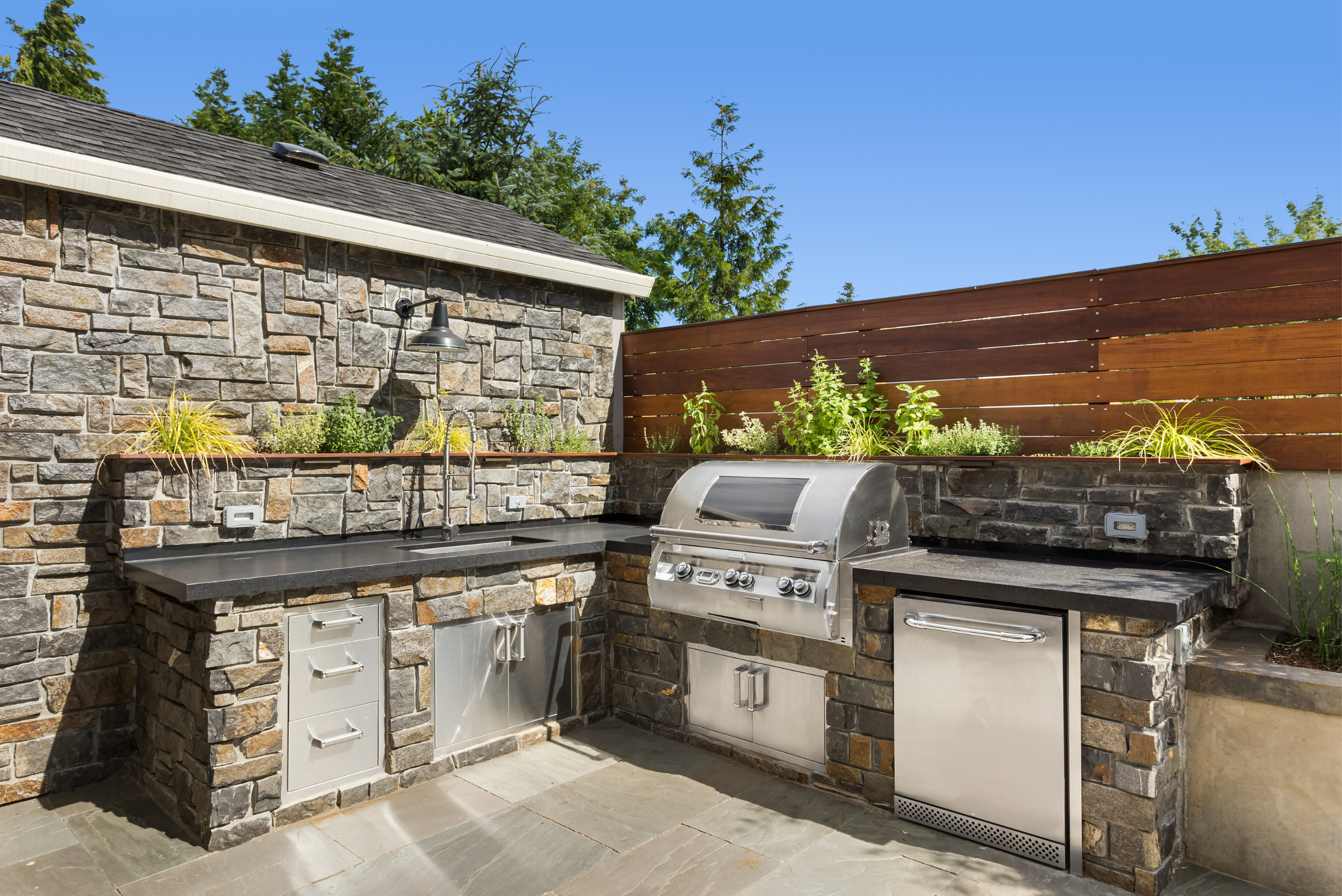 Backyard patio with kitchen.