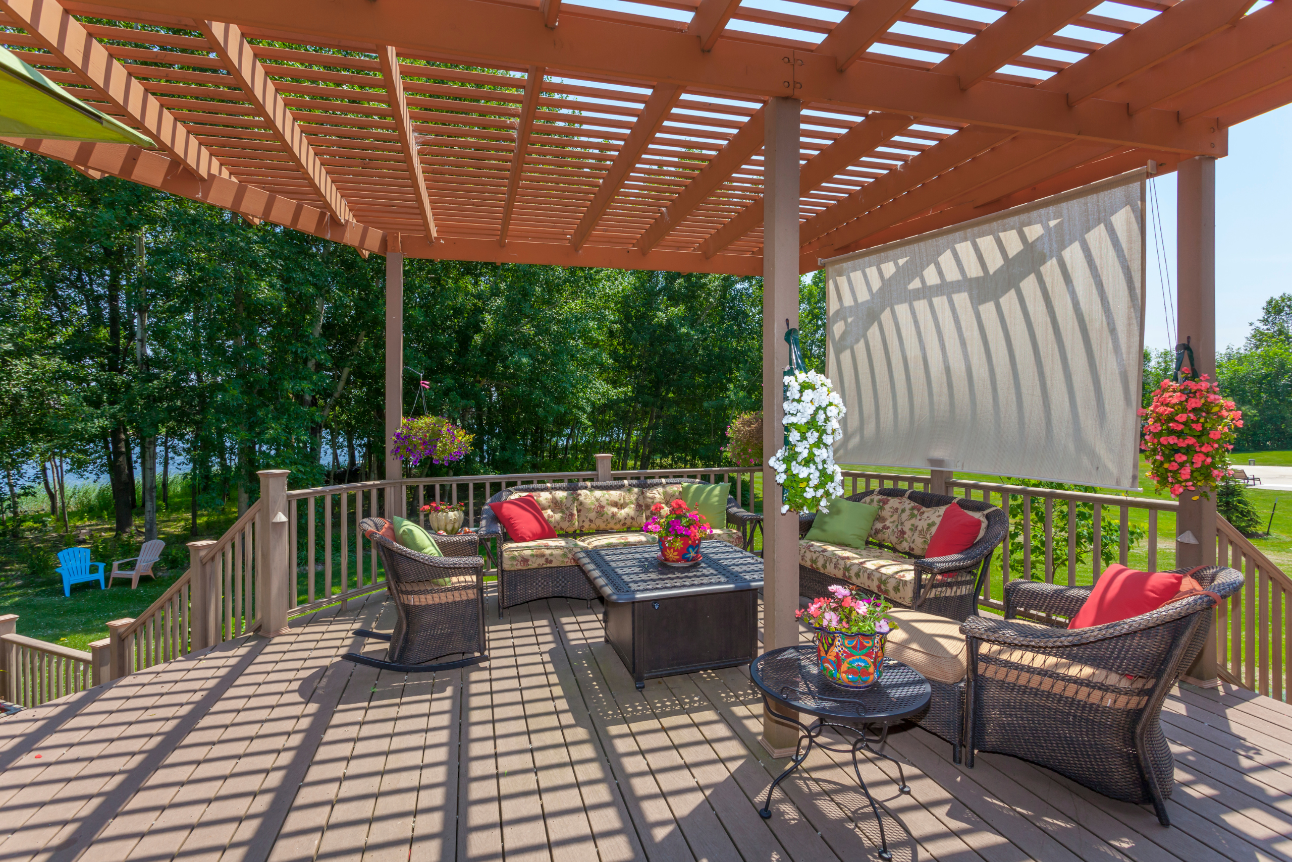 Pergola shading a patio set and deck.