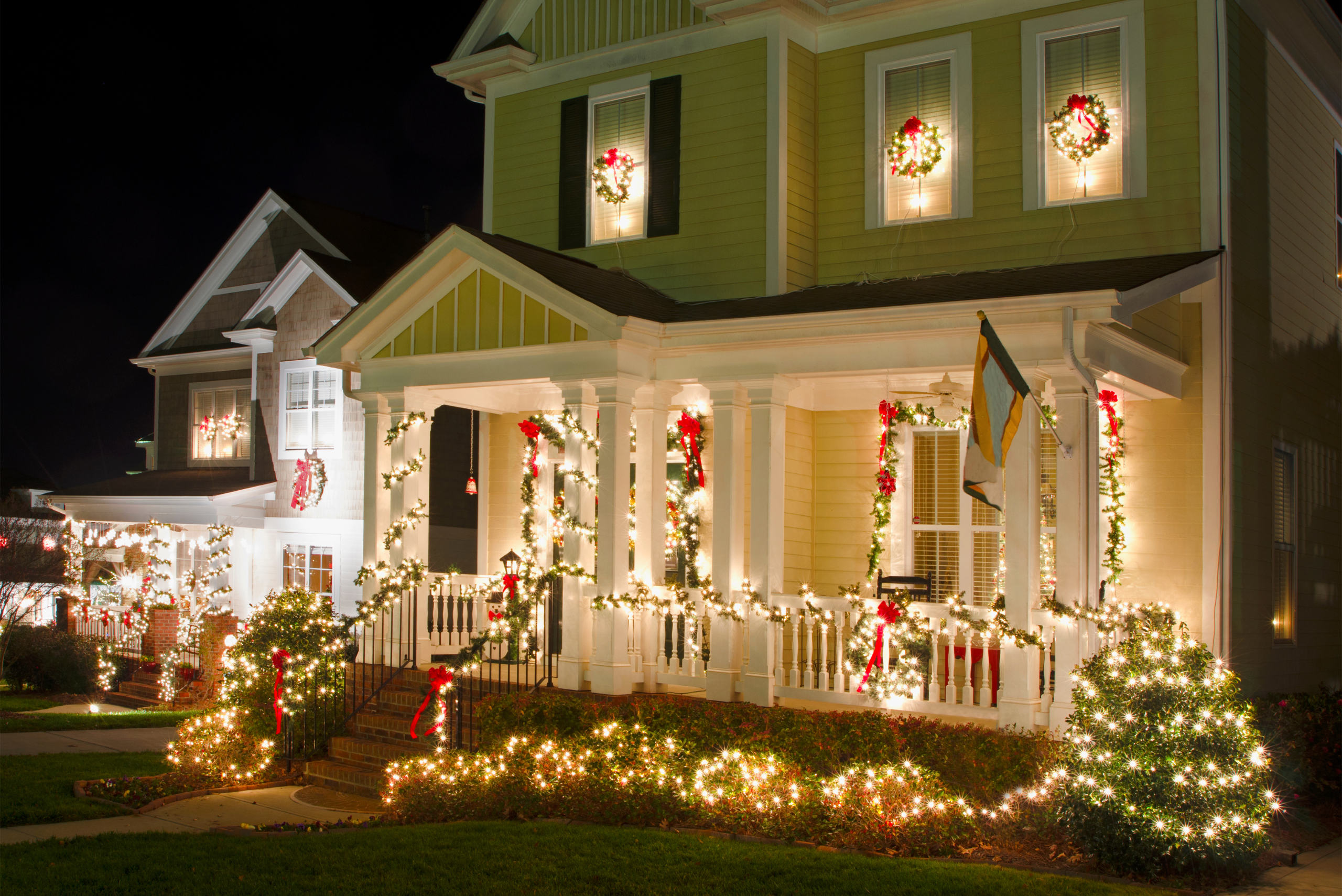 House covered in festive lights for the holidays.