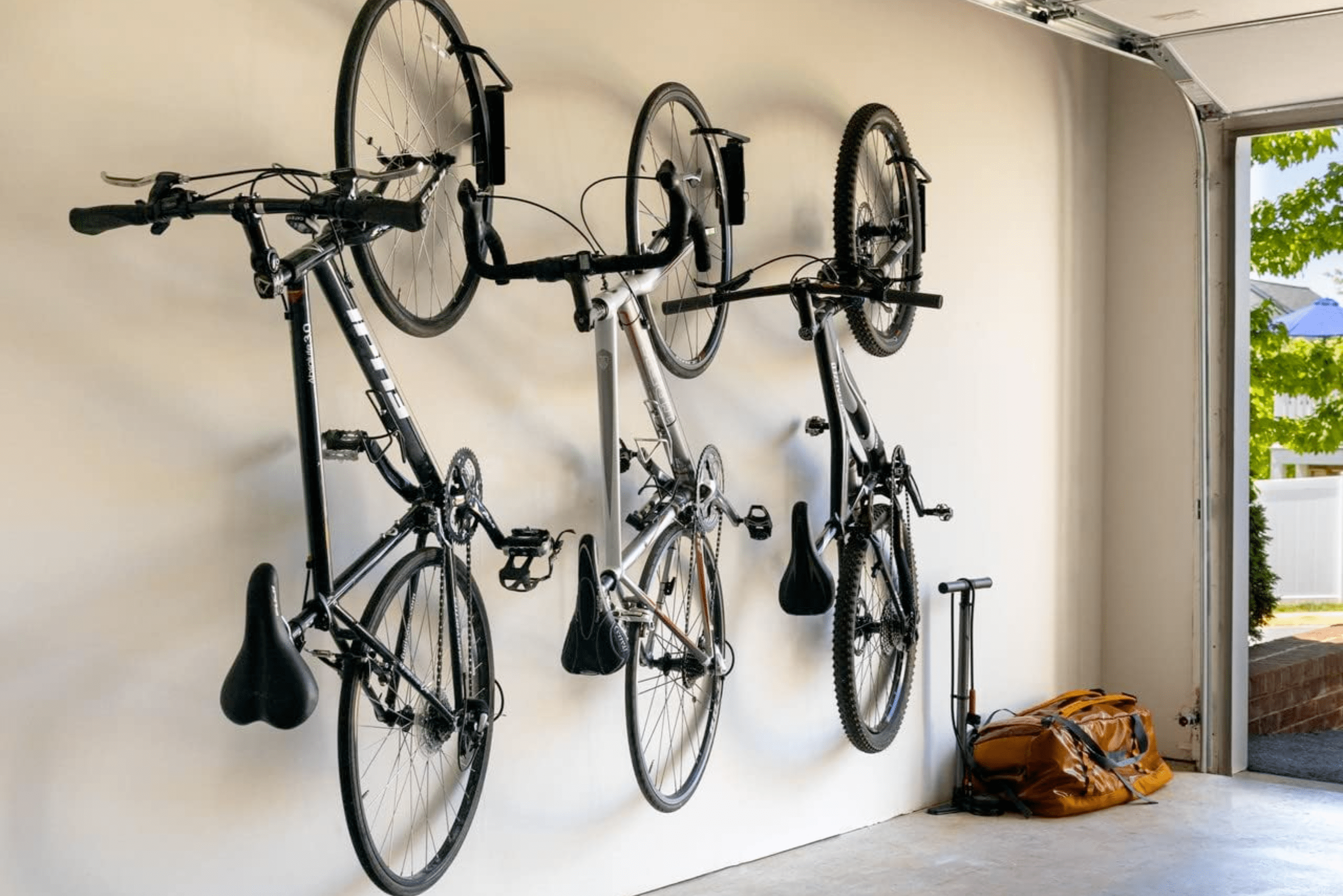 Bikes mounted on a wall garage bike rack.