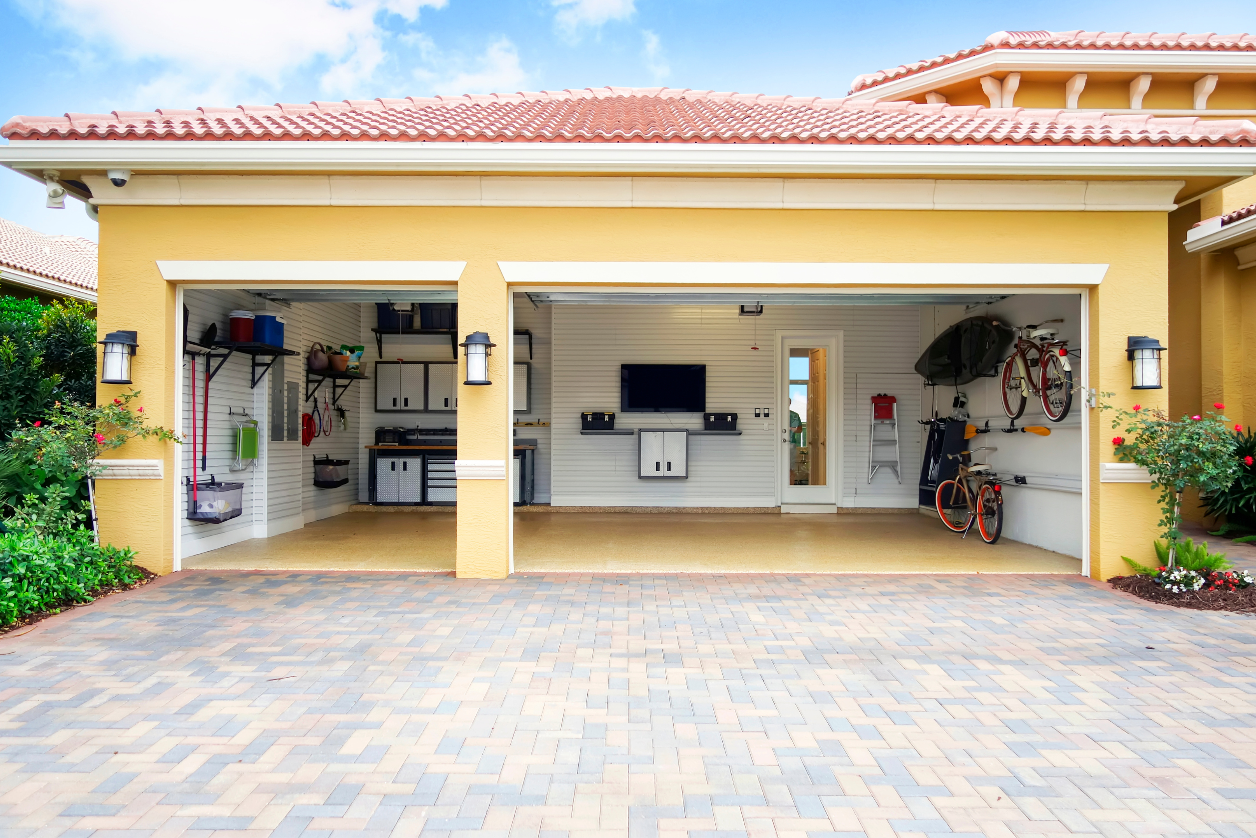 Garage with wall-mounted shelving.