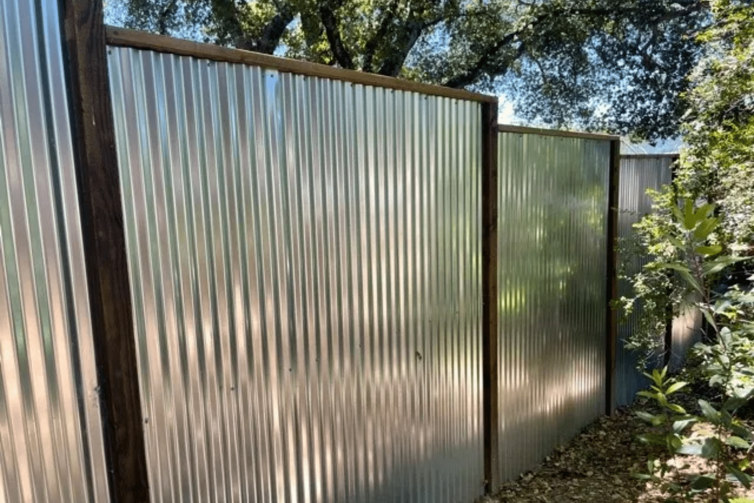 Corrugated fencing with black frame.
