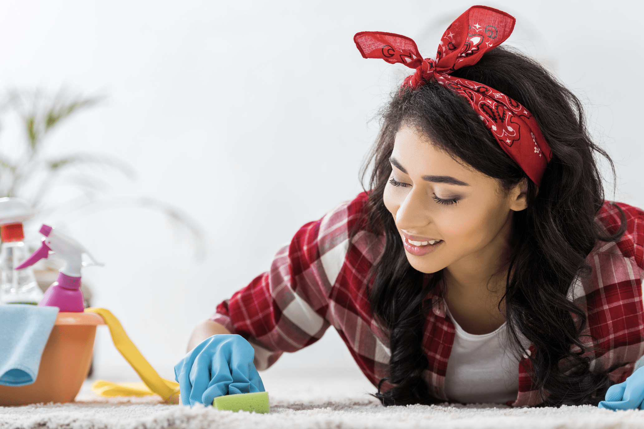 Woman cleaning carpet.