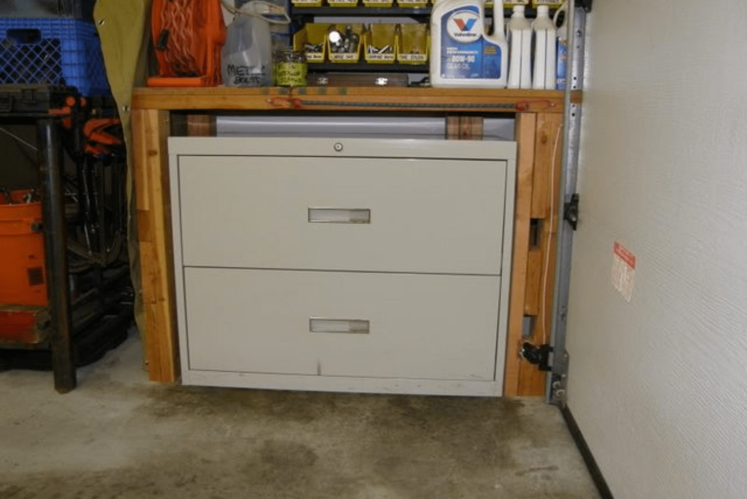Filing cabinet used as a power tool storage solution.