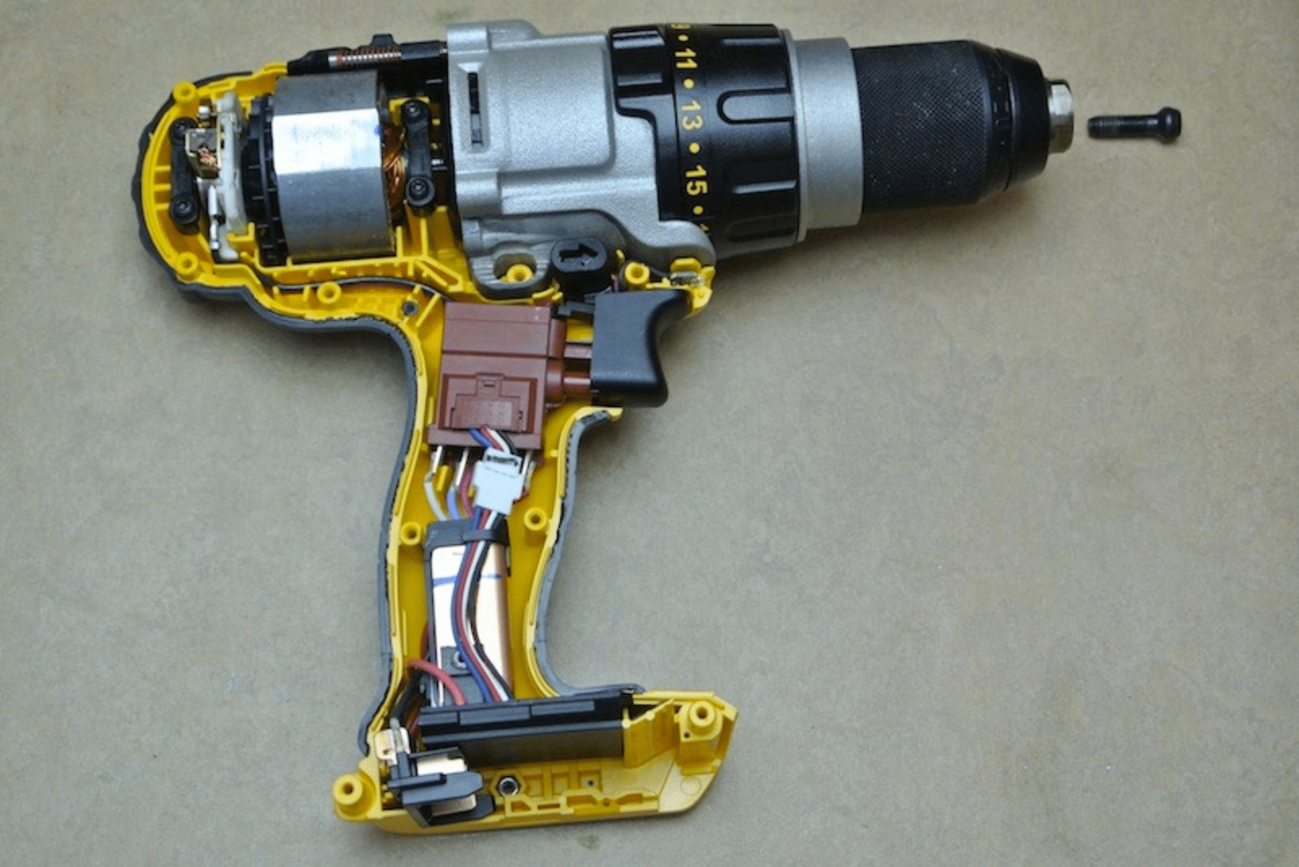 A hammer drill taken apart, showcasing its internal components.