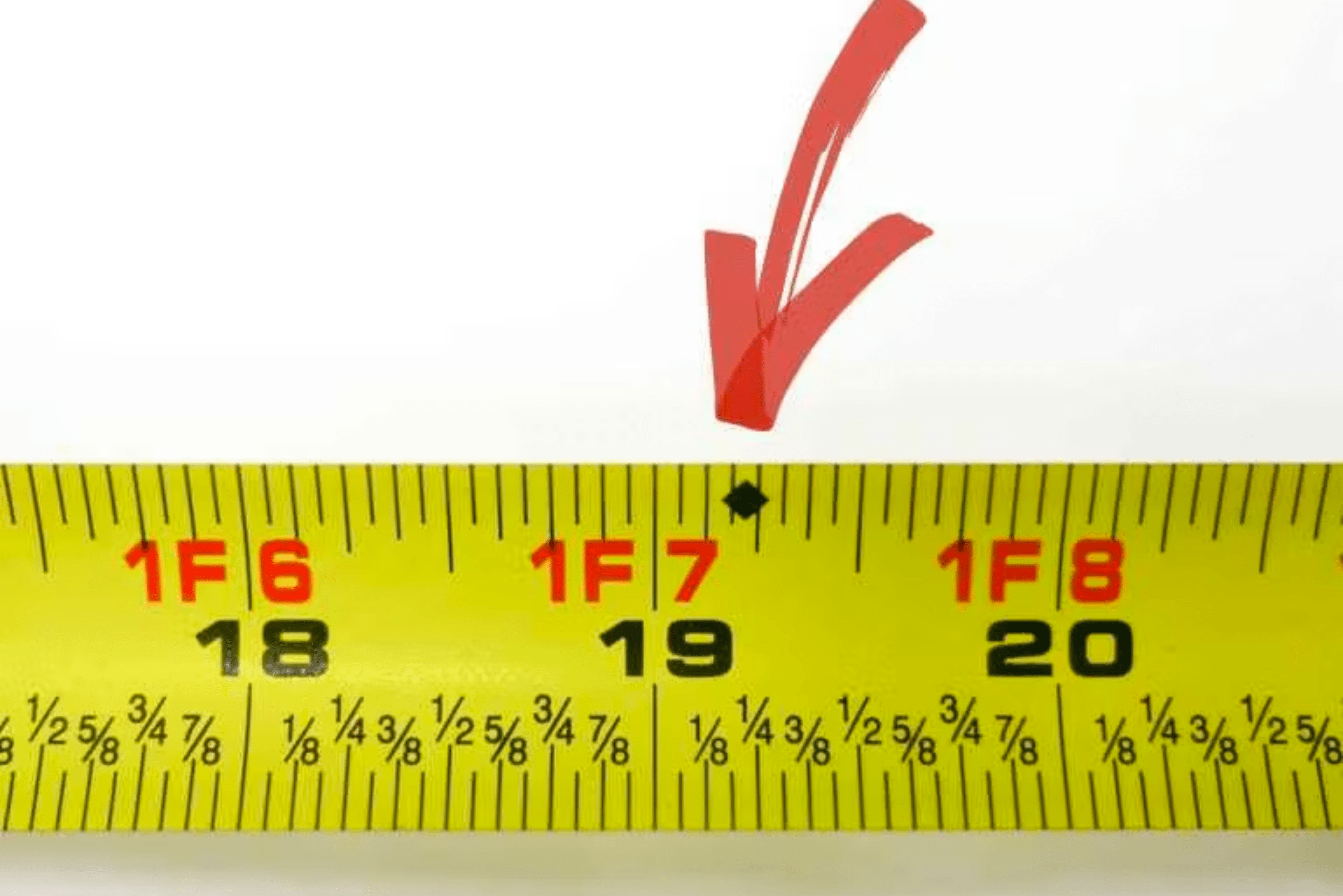 A measuring tape with a black diamond marking.