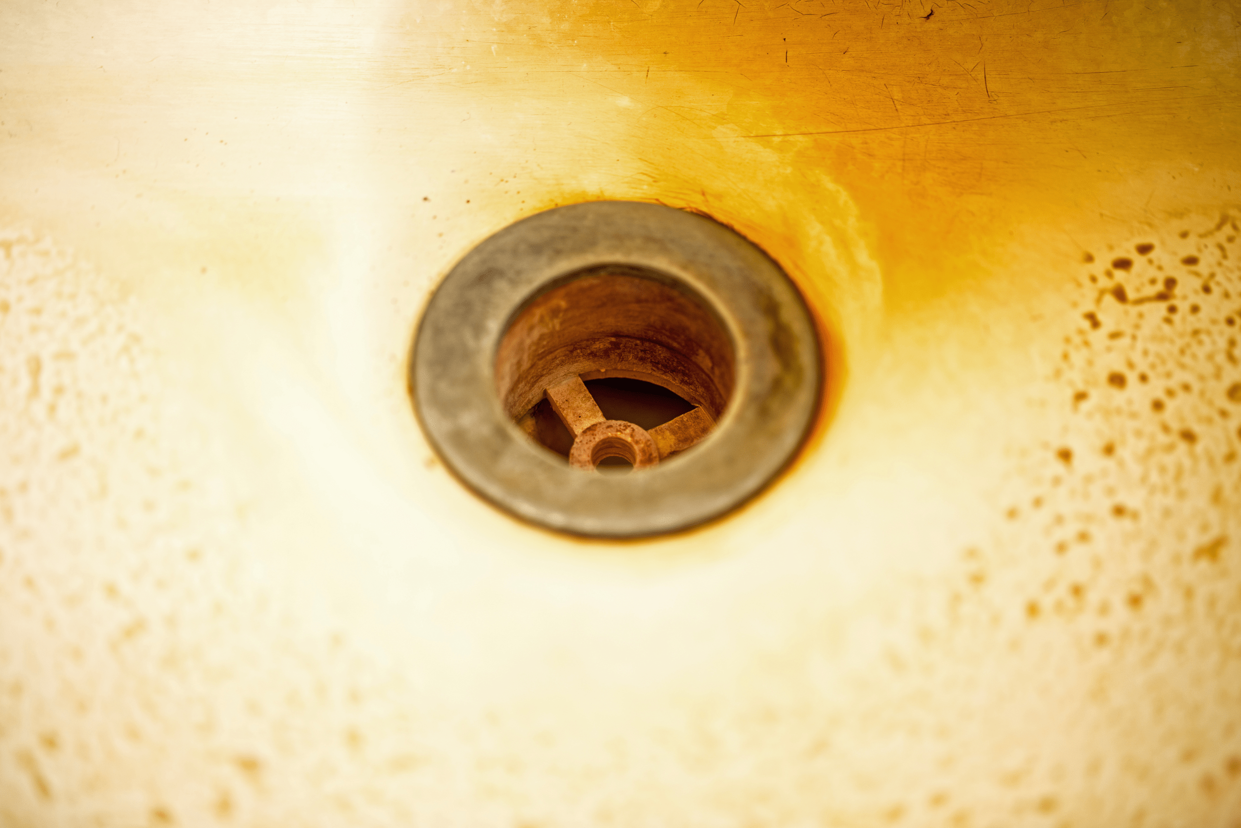 Rusty bathtub drain.