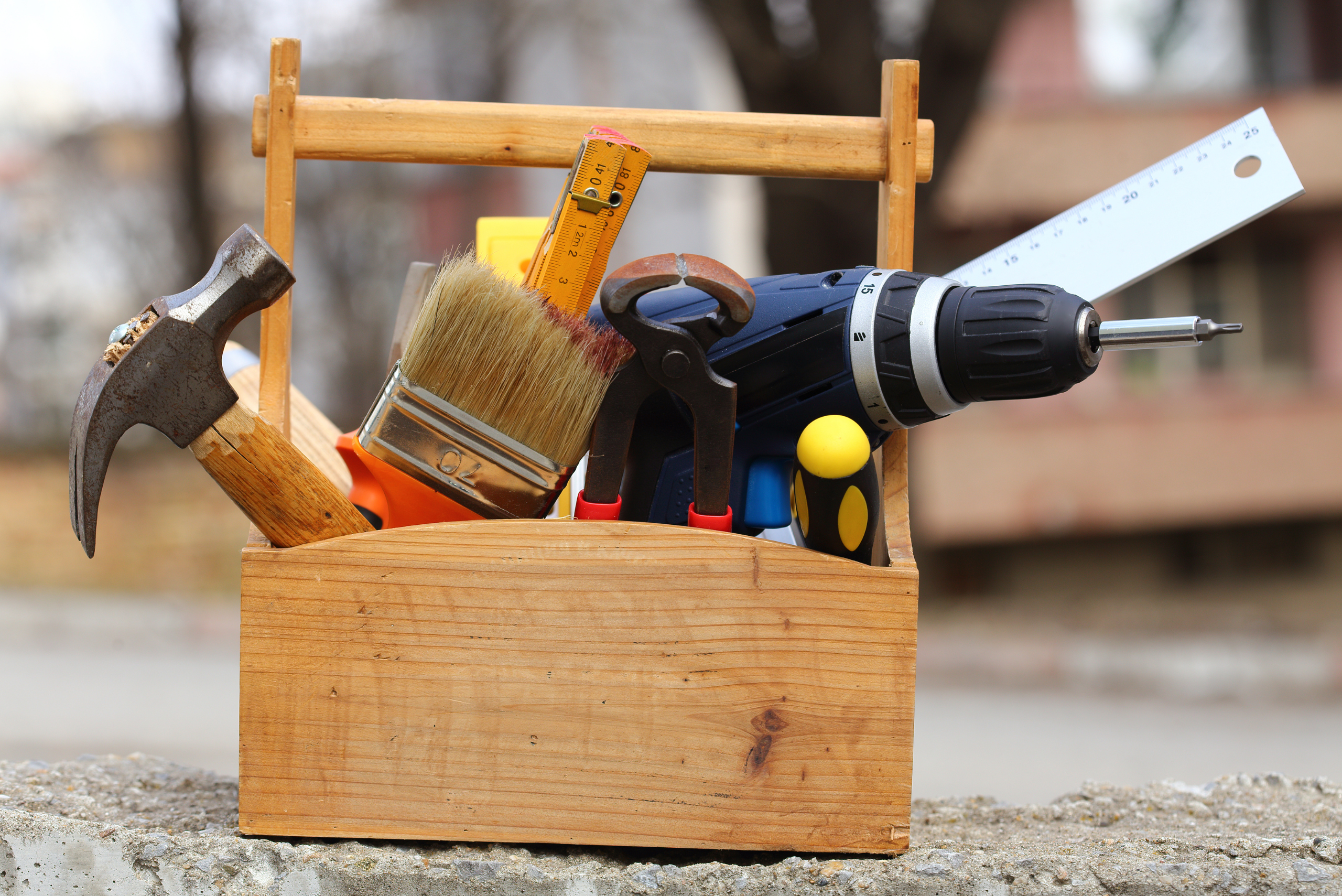 Tools inside a wooden DIY box.