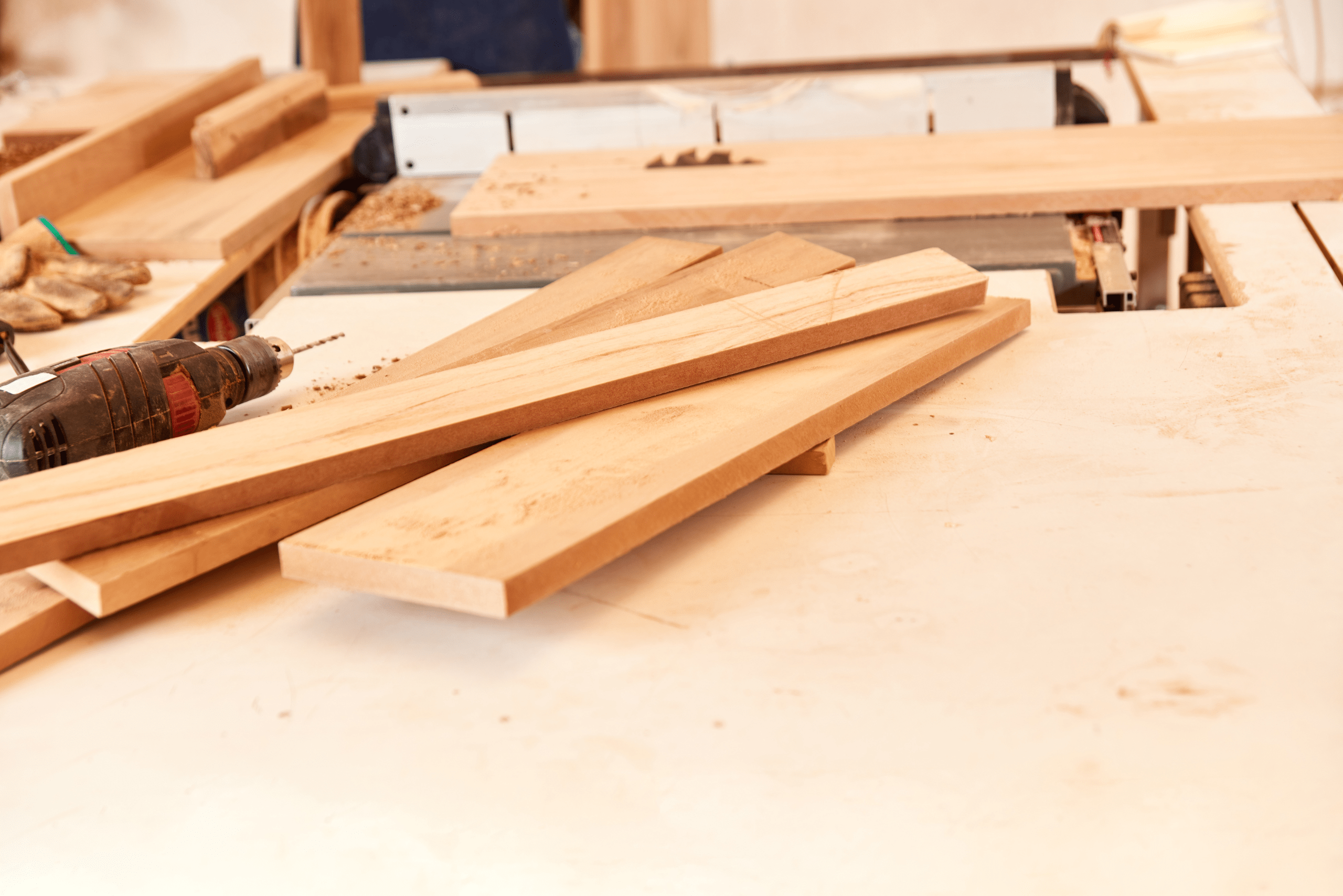 A pine of wooden boards on a table.