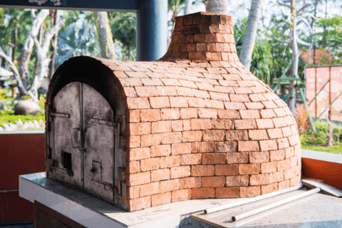 Large brick DIY outdoor pizza oven.