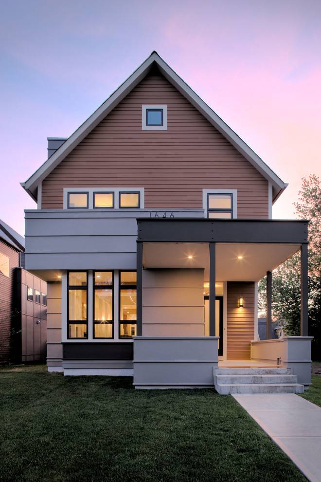 hardie board sided house with sunset in background brown siding modern exterior