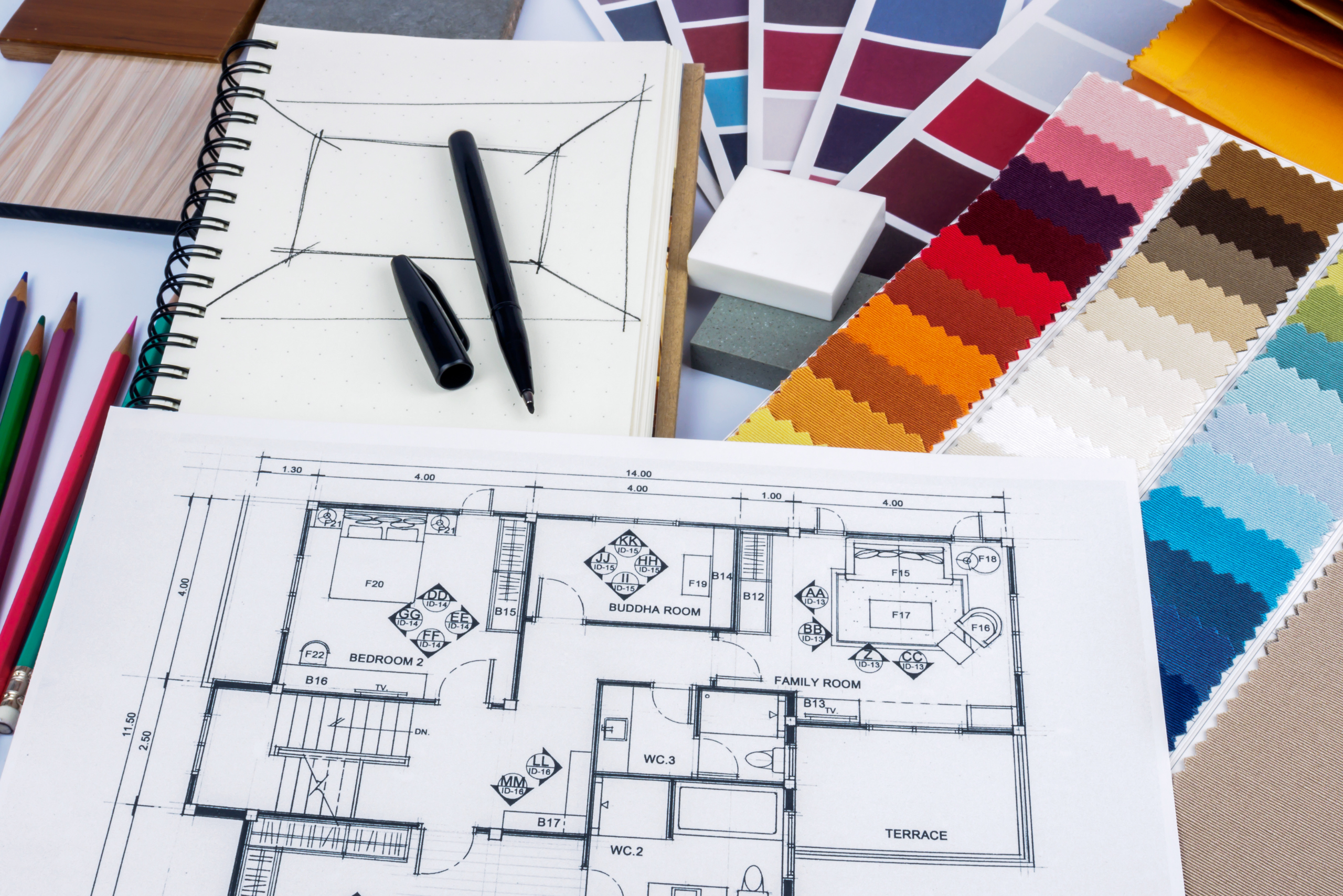 Blueprint of a basement layout flanked by a color palette.