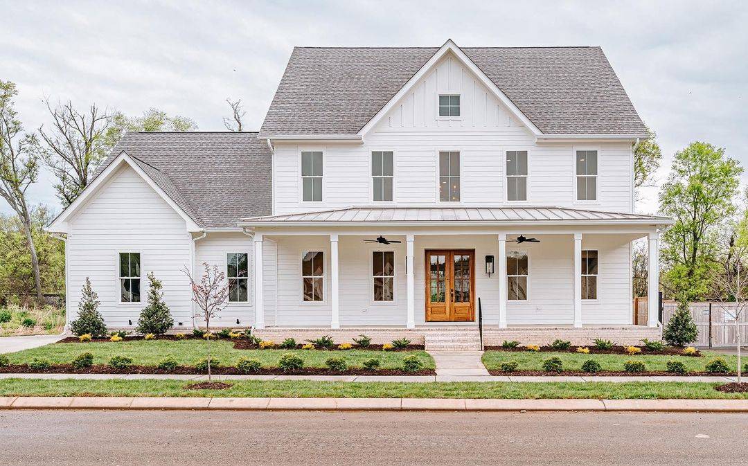 white modern farmhouse exterior with hardie board siding