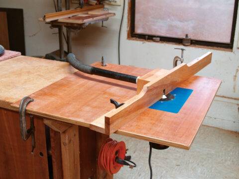 A hardwood DIY router table with guide.