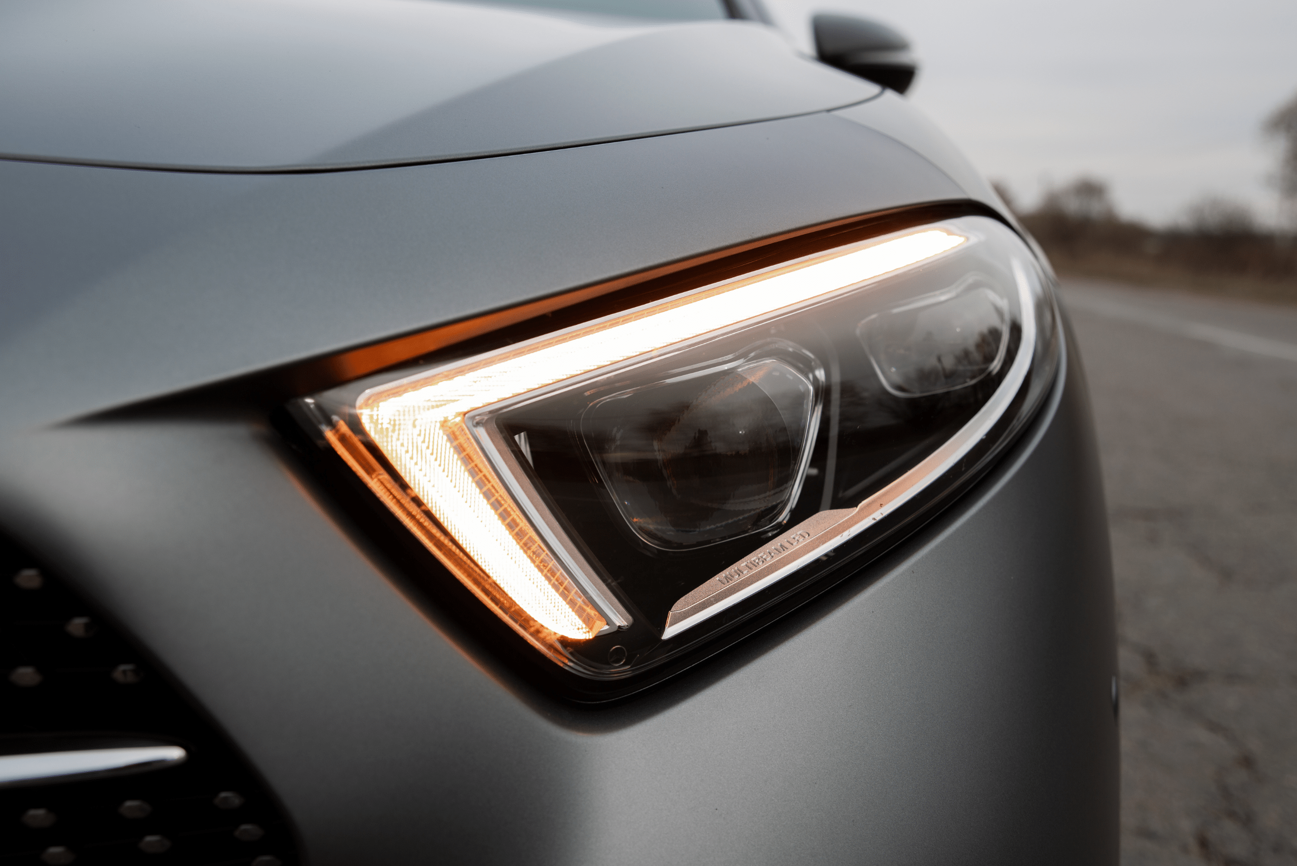 A closeup of a Mercedes-Benz's clear headlights.