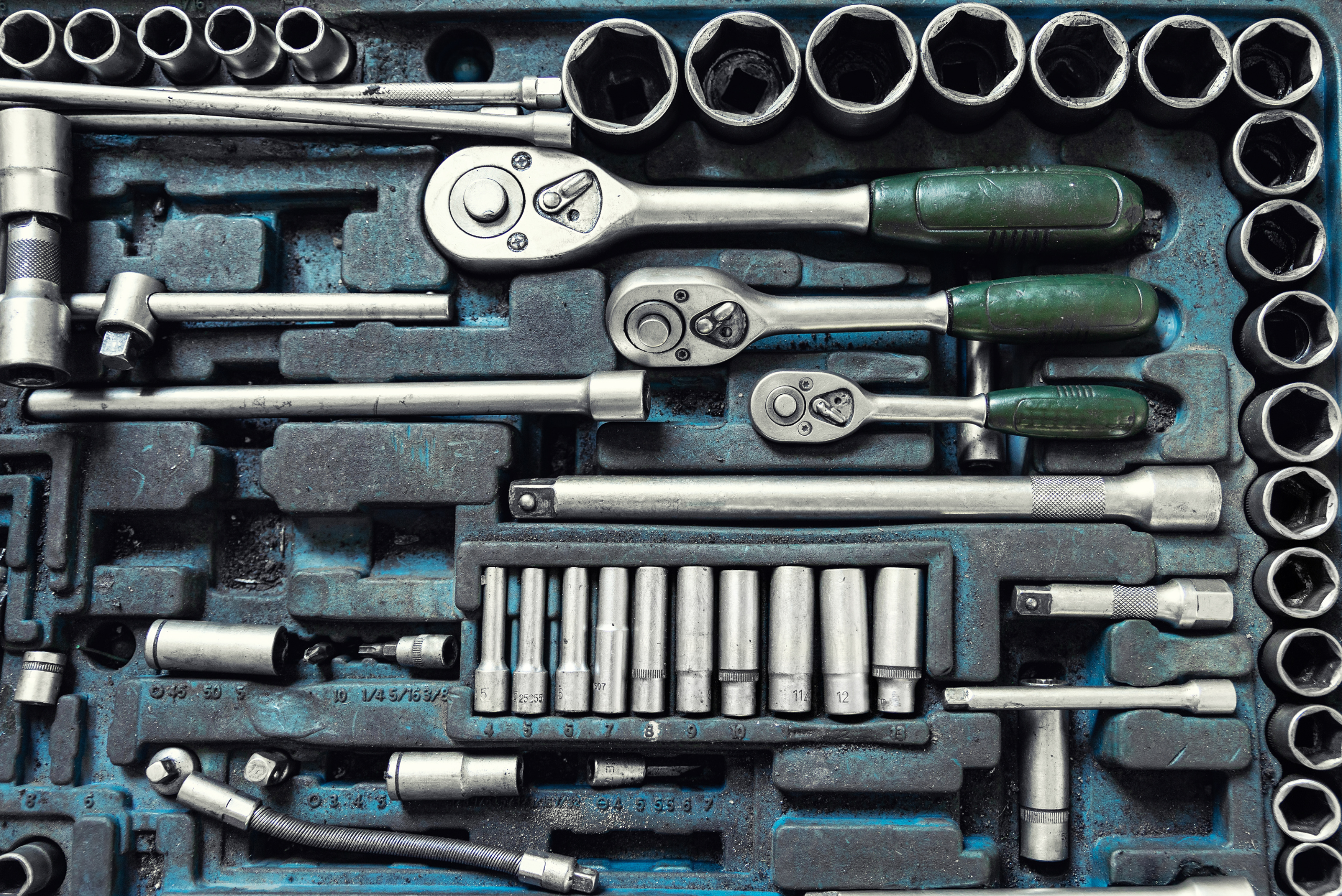 A socket set with missing pieces.