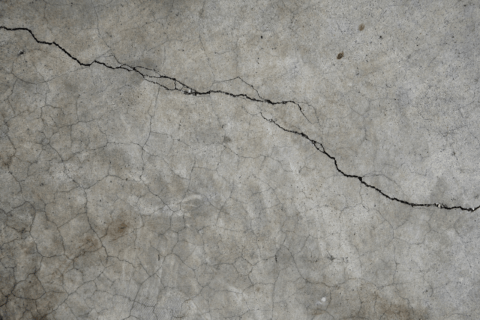 Concrete floor with cracks.