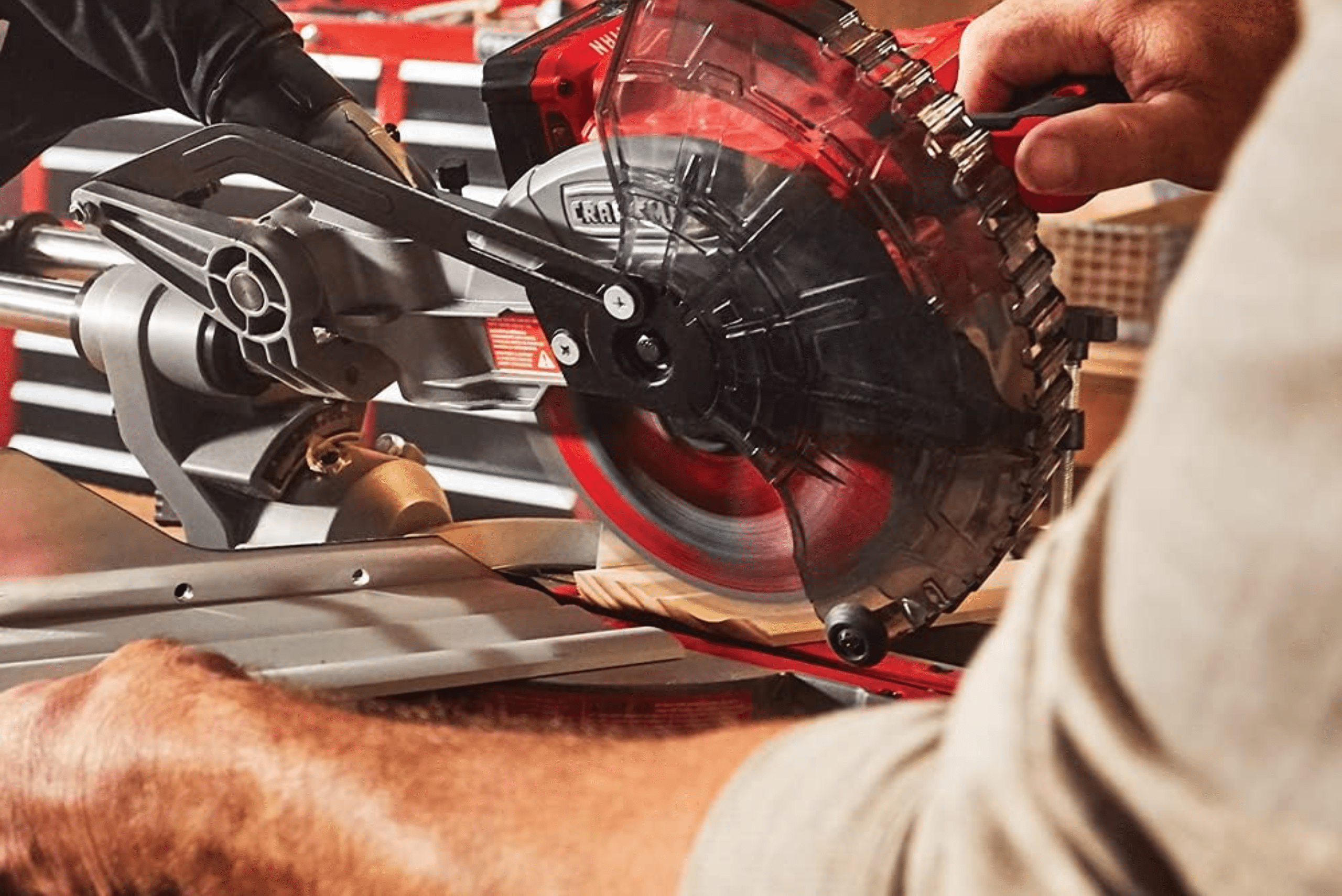 A Craftsman single-bevel miter saw cutting wood.