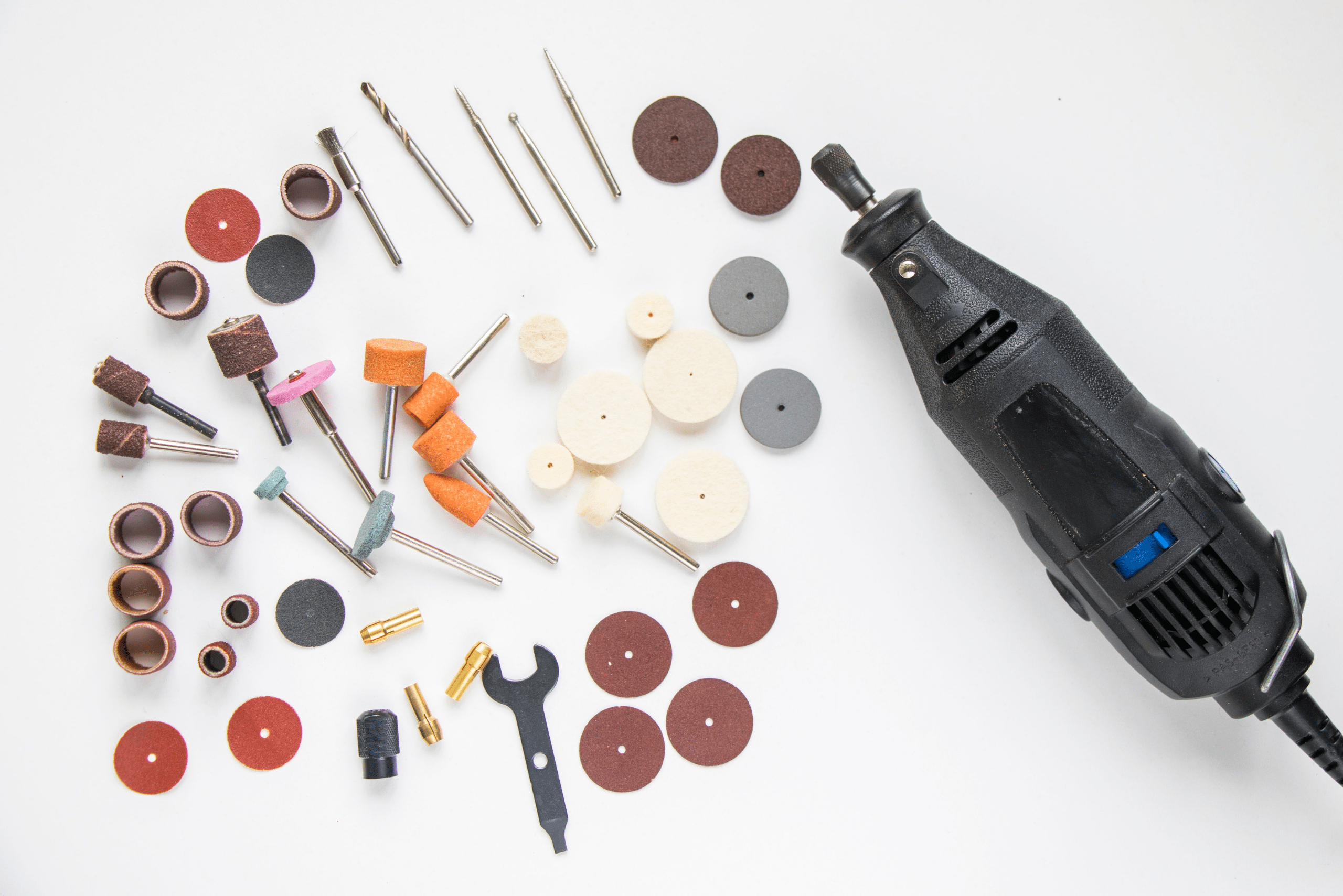 An assortment of attachments and a Dremel tool.