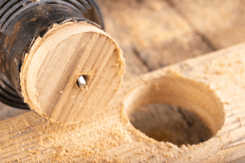 Drilling in wood to create a perfect circle.