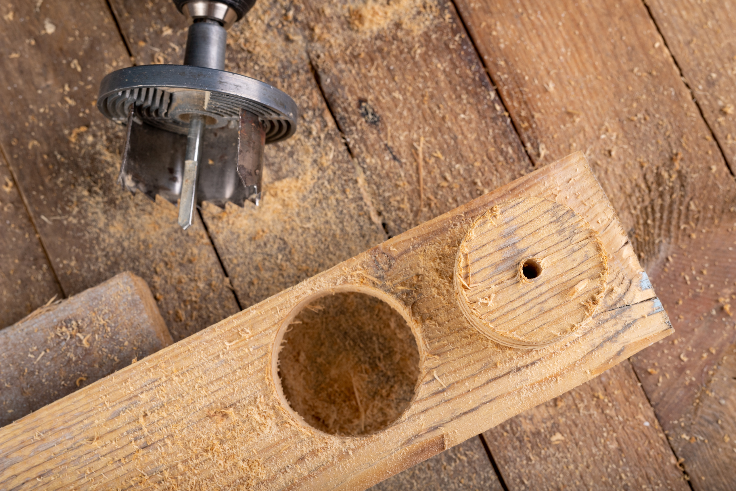 Drilling in wood to create a perfect circle.