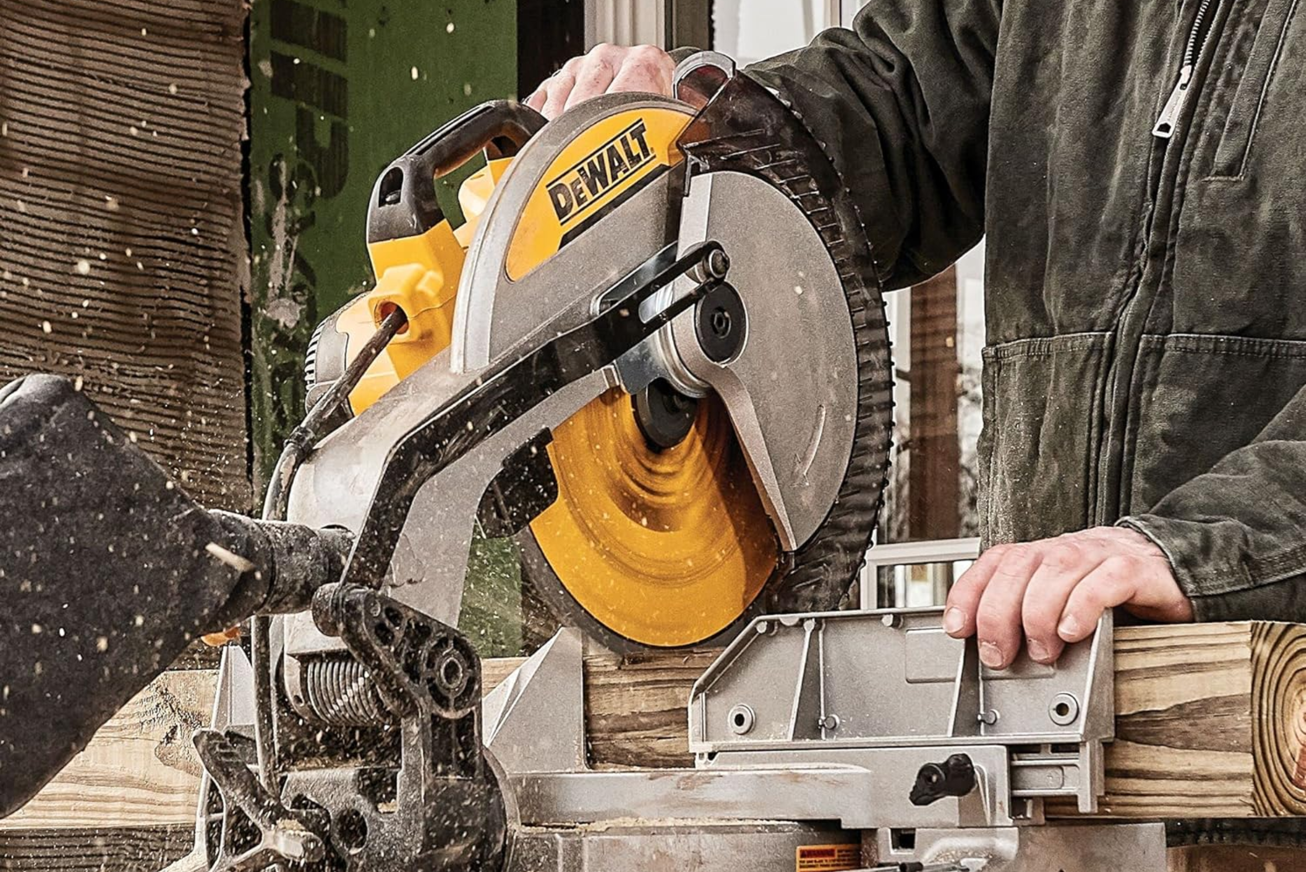 A DeWalt single-bevel miter saw cutting wood.