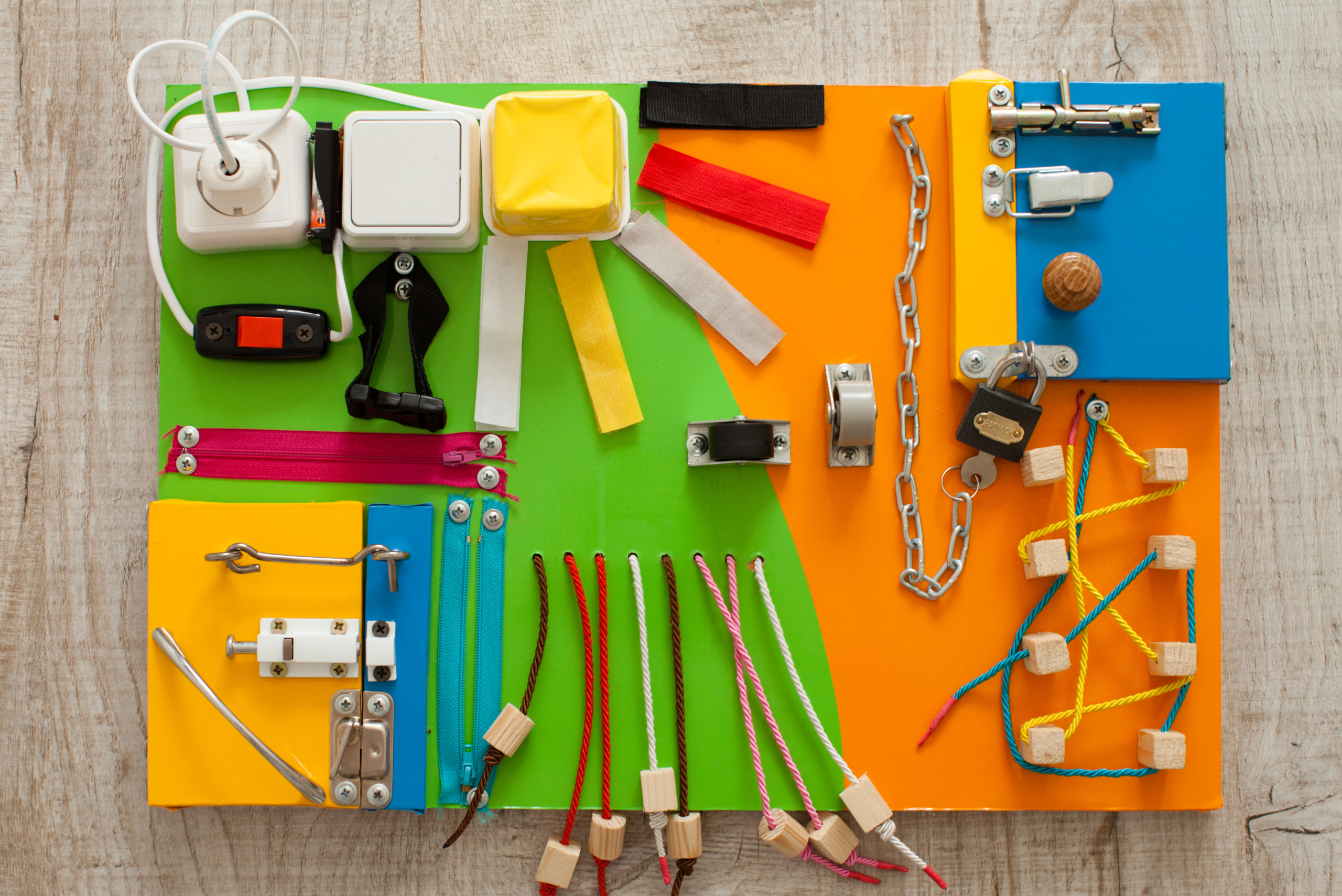 An assortment of items on a DIY busy board.