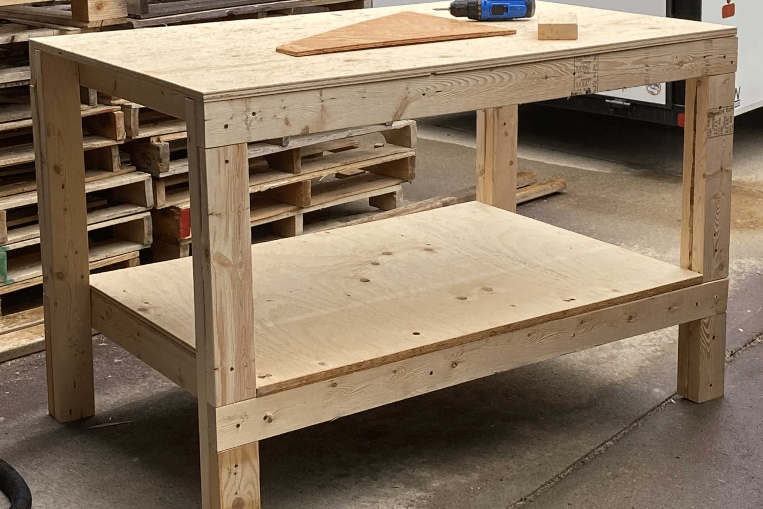 A wooden DIY workbench in a garage workshop.