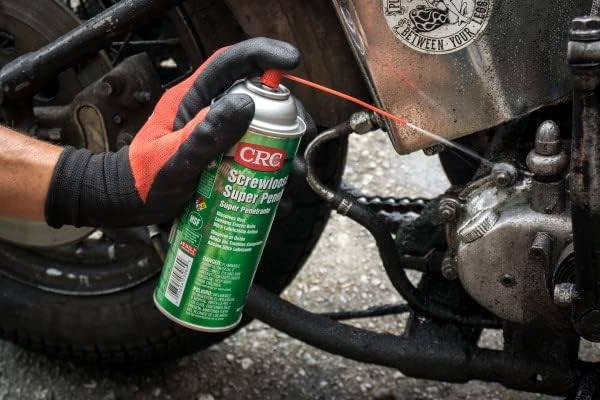 Penetrating oil being used on a motorcycle.