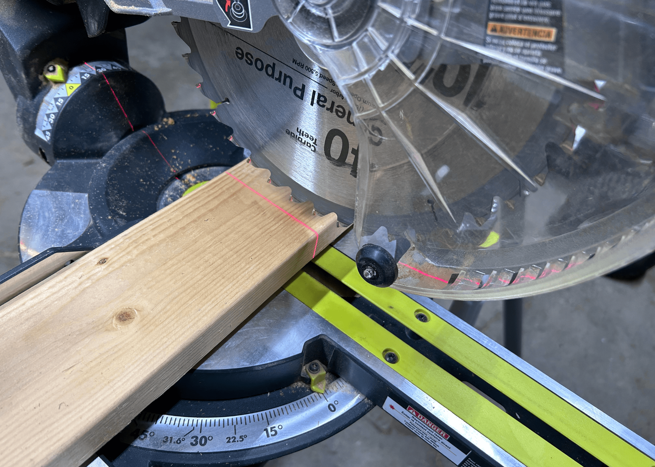 laser on a piece of wood on a miter saw