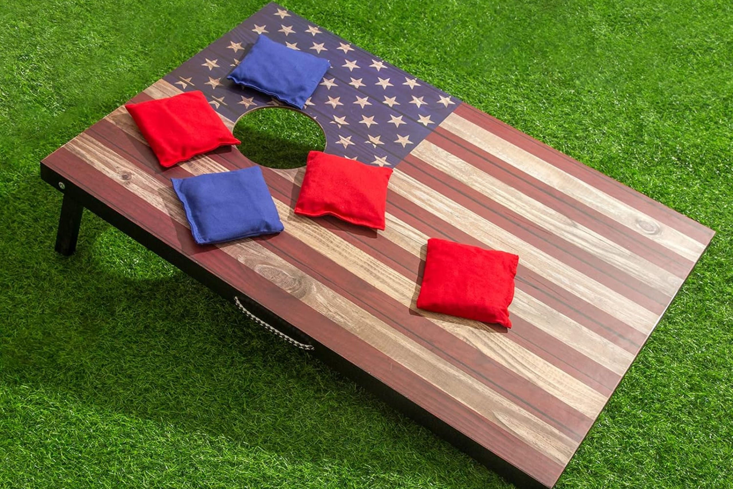 A cornhole with American flag design.