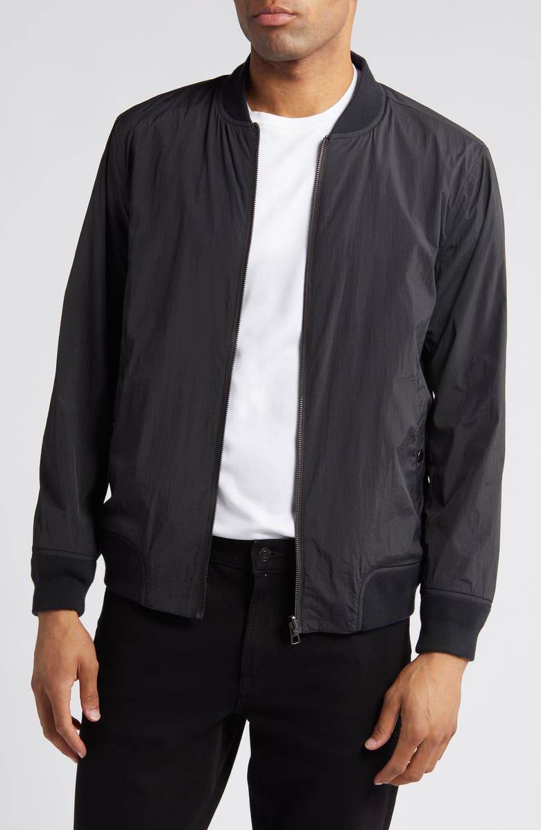 A man wearing a bomber jacket.