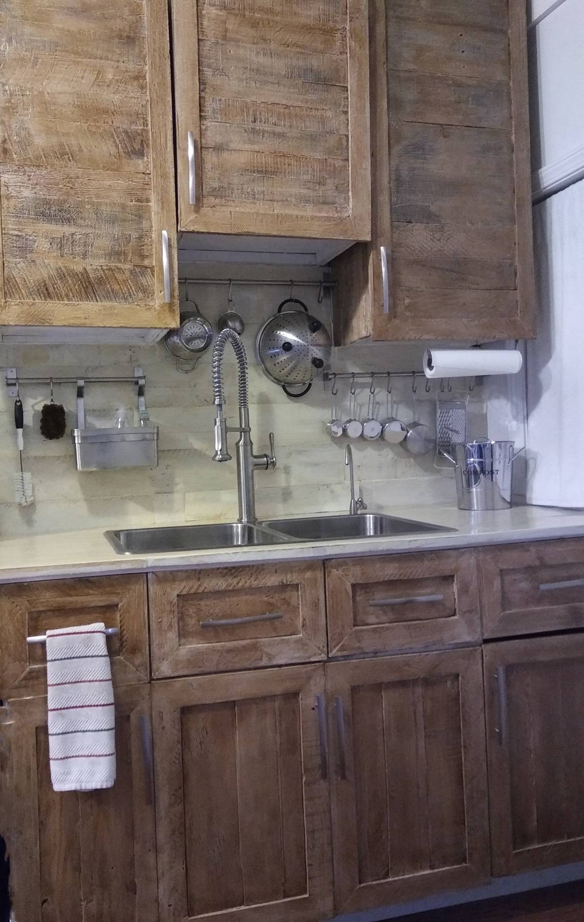 A kitchen with cabinets made of pallets.