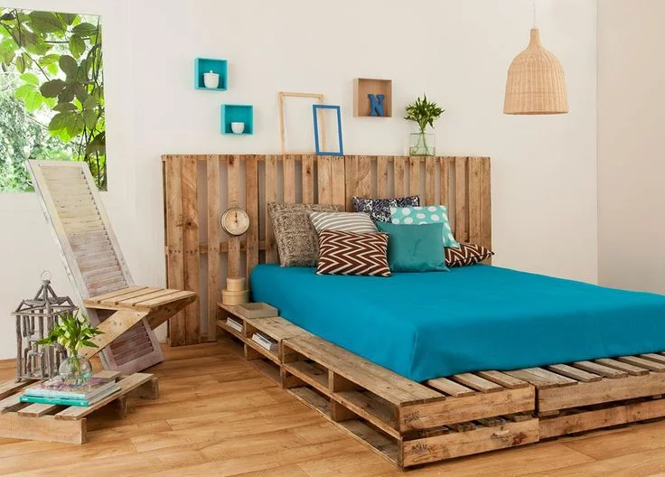 A DIY bed frame made from pallets.