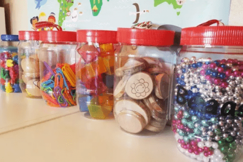 An assortment of peanut butter jars used as storage.