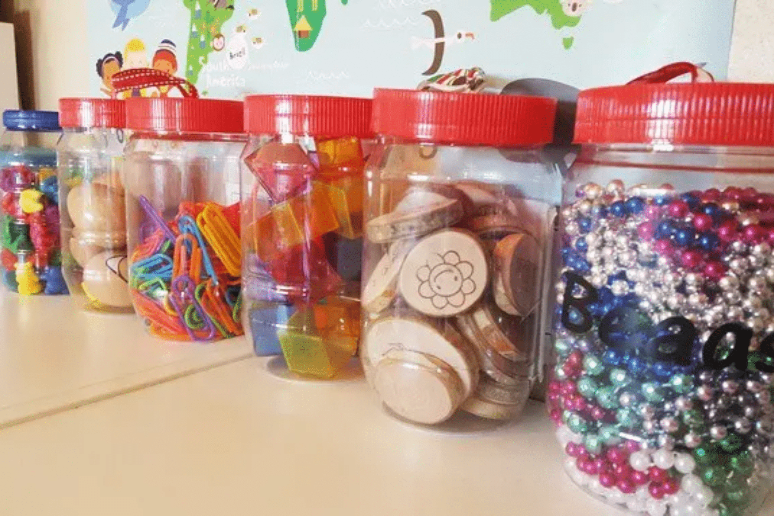 An assortment of peanut butter jars used as storage.