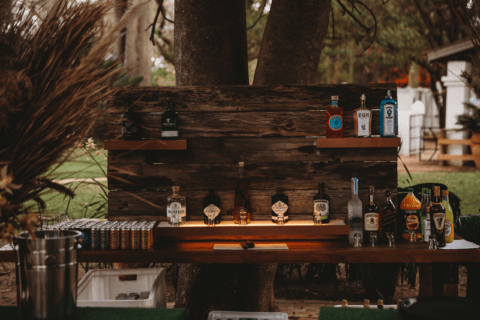 A rustic wooden DIY outdoor bar.