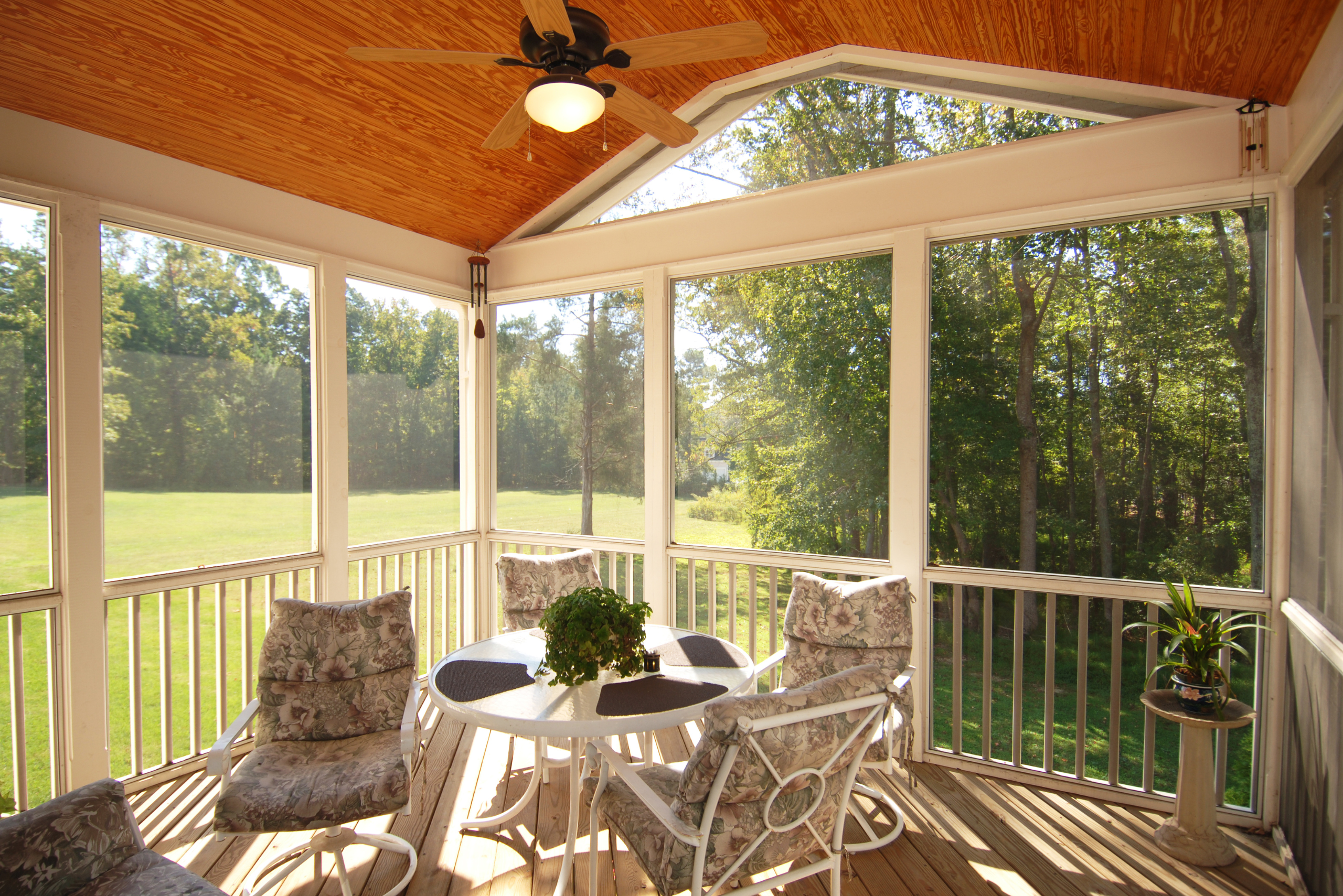 Screened-in porch with white-painted framing.