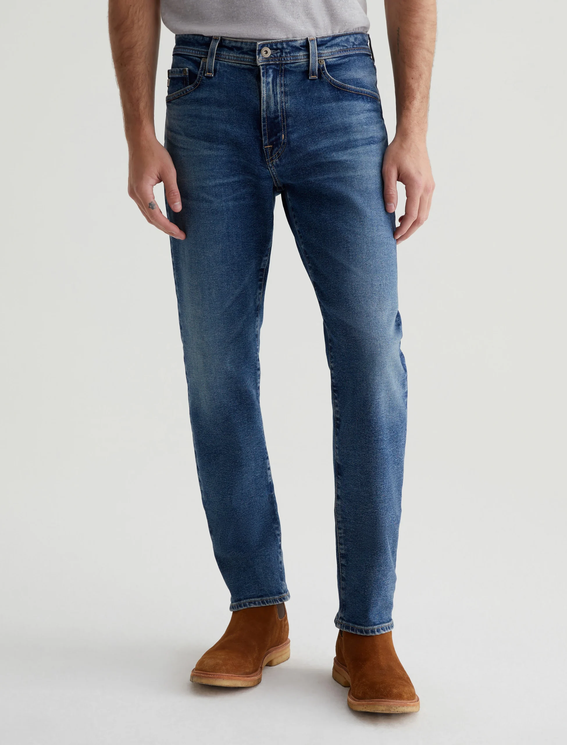 A person wearing straight leg jeans.