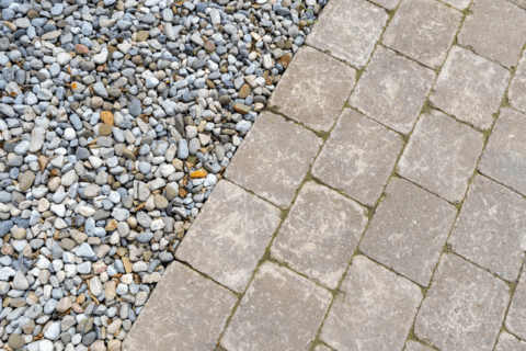 Bricks with pea gravel with clear edge.