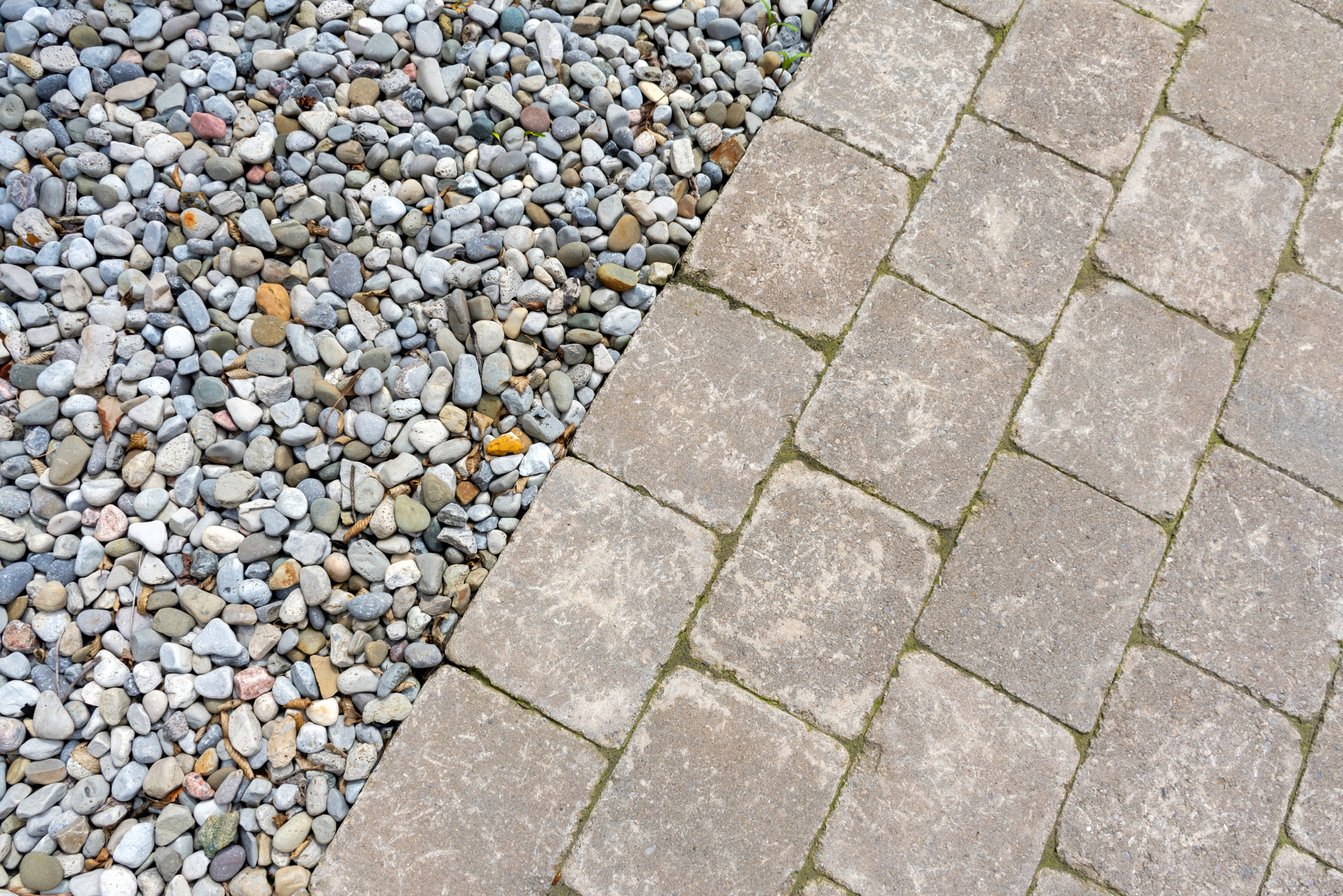 Bricks with pea gravel with clear edge.