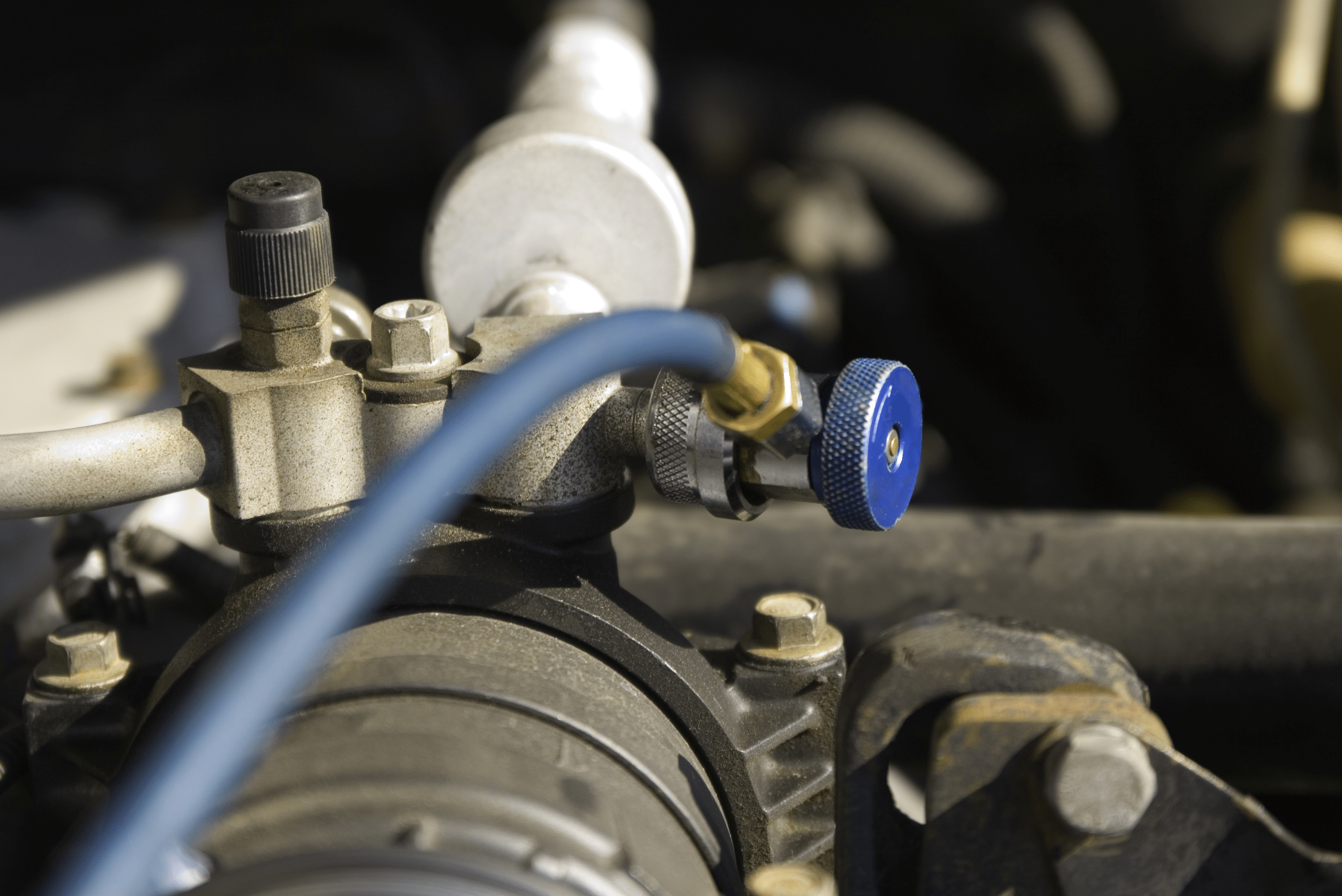 AC recharging port under the hood of car.